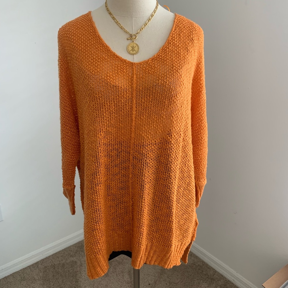 Soft orange knitted quarter sleeve sweater